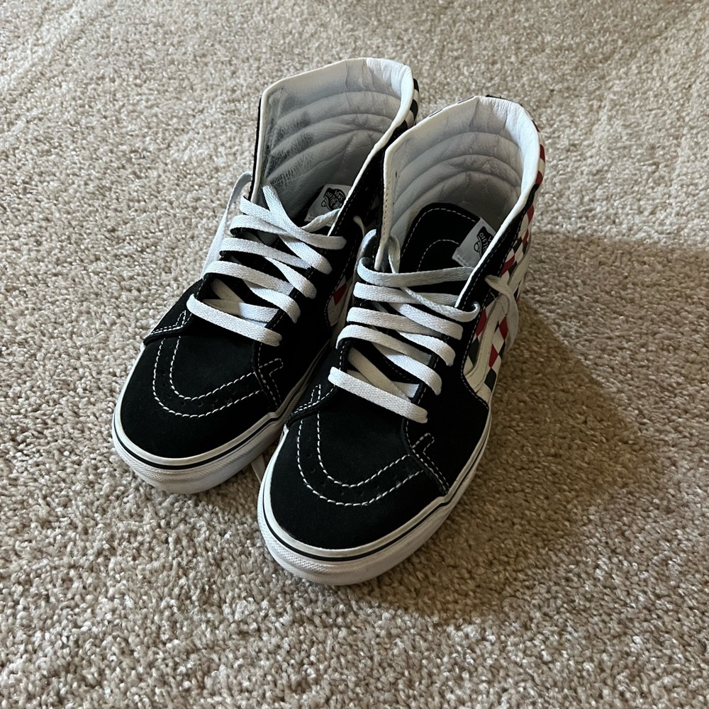Vans high top with black/white/red checker. Barely worn. Size 9.
